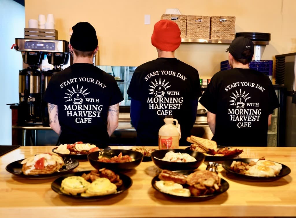 Morning Harvest team with a counter full of scratch-made breakfast plates